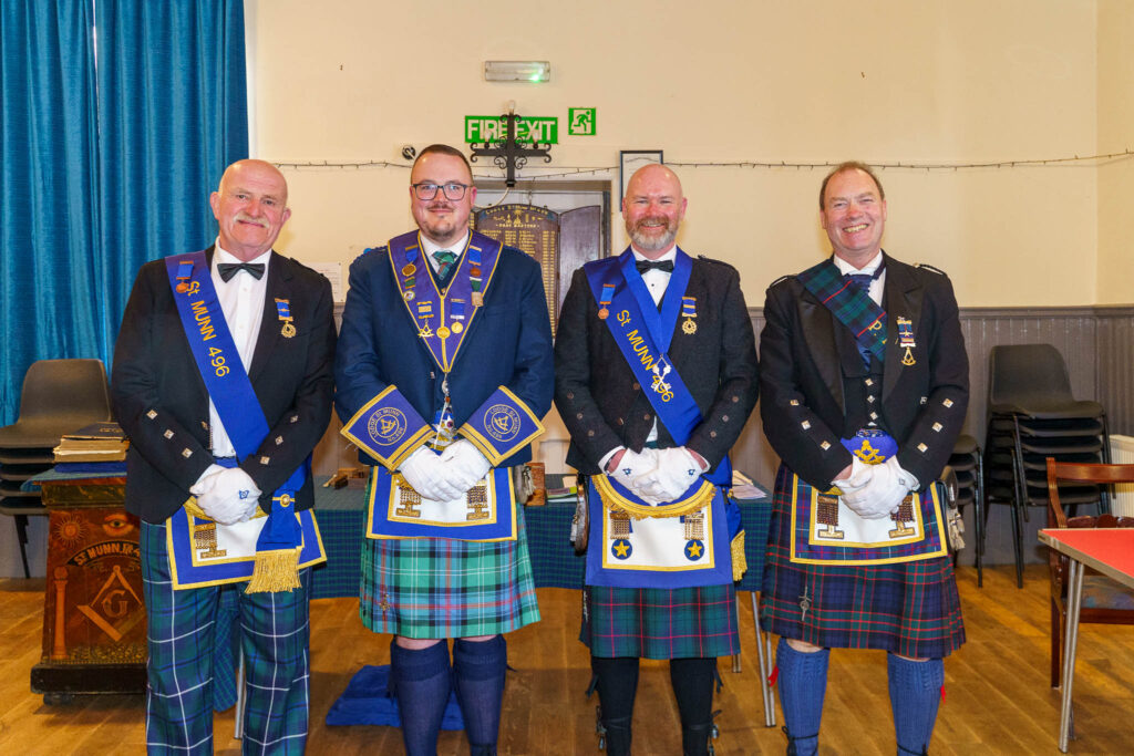 Four men in masonic reglia at an installation ceremony in Scotland